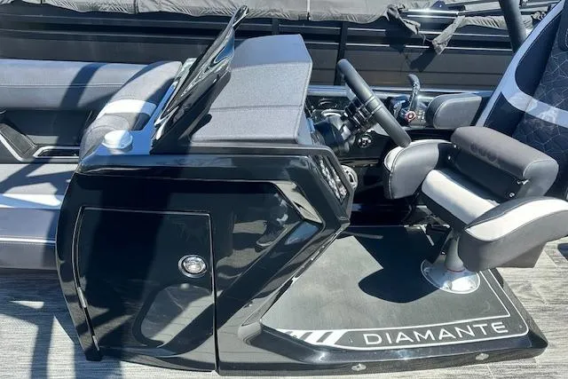 Slide: The Image of 2025 Viaggio Diamante S boat cockpit with sleek black console and comfortable seating. - 14