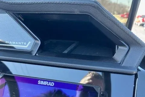 Slide: The Image of 2025 Viaggio Diamante S dashboard with Simrad display and storage compartment. - 18