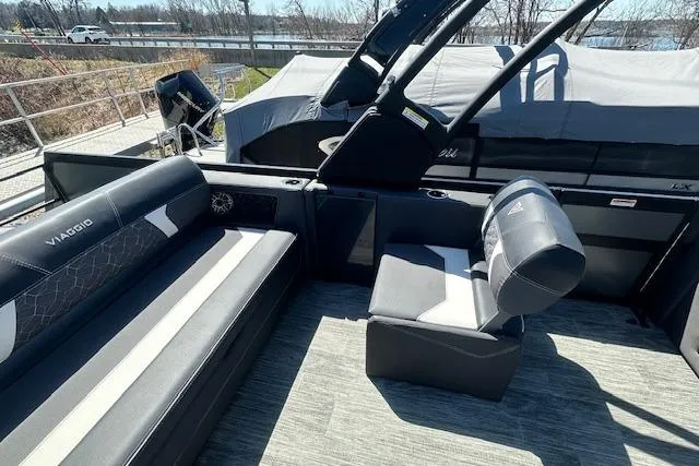 Slide: The Image of 2025 Viaggio Diamante S boat interior with black and white seating, outdoor setting. - 37