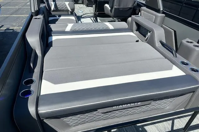 Slide: The Image of Luxurious seating on 2025 Viaggio Diamante S boat with quilted upholstery and cup holders. - 41