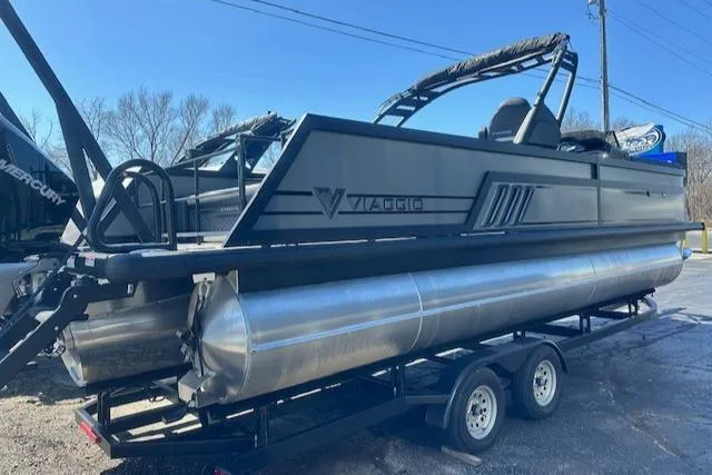 Slide: The Image of 2025 Viaggio Diamante S pontoon boat on trailer, sleek design, outdoor setting. - 5