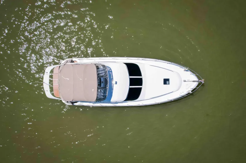 Slide: The Image of Overhead view of 1998 Sea Ray 400 Sedan Bridge yacht on calm water. - 10