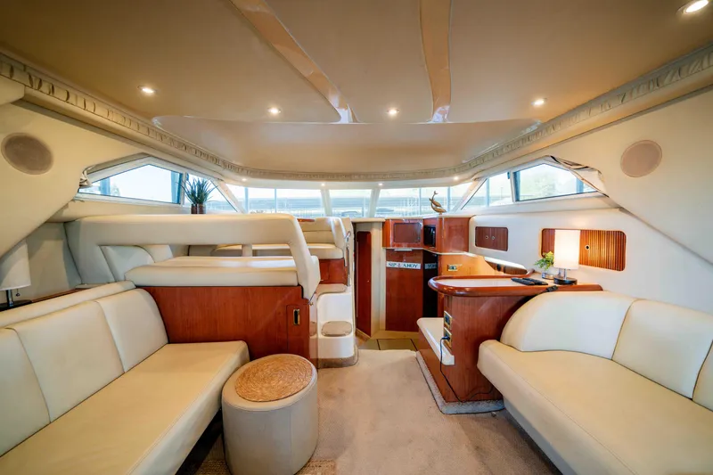 Slide: The Image of Luxurious interior of a 1998 Sea Ray 400 Sedan Bridge yacht with elegant seating. - 18