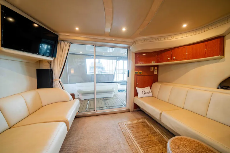 Slide: The Image of Luxurious interior of 1998 Sea Ray 400 Sedan Bridge yacht with leather seating and modern amenities. - 20