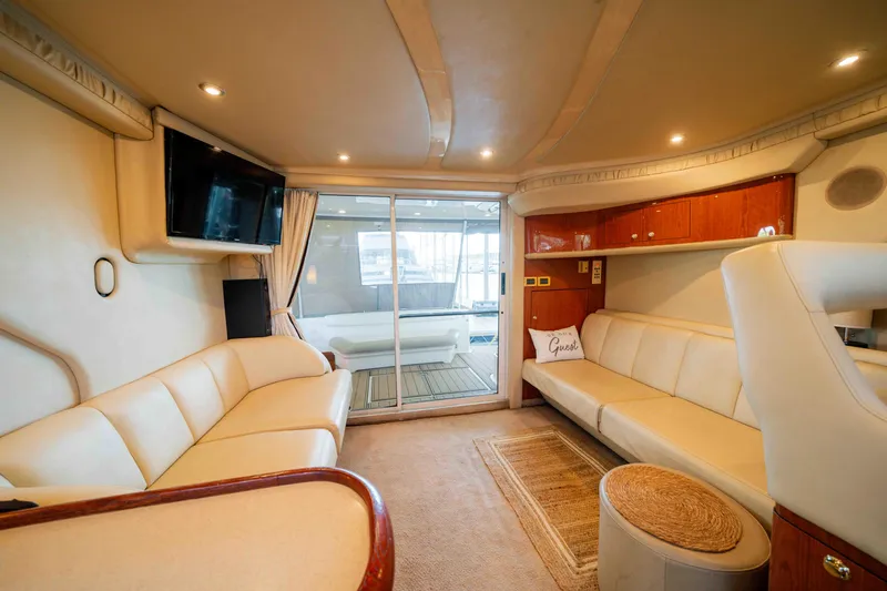 Slide: The Image of Luxurious interior of 1998 Sea Ray 400 Sedan Bridge yacht with plush seating and modern amenities. - 21