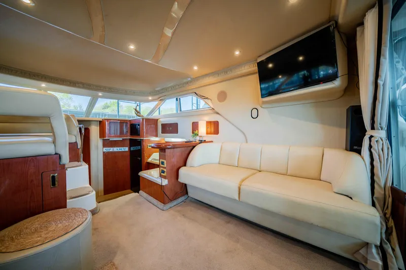 Slide: The Image of Luxurious interior of a 1998 Sea Ray 400 Sedan Bridge yacht with plush seating and modern amenities. - 25