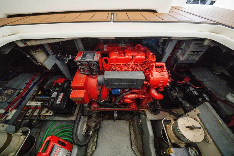 Slide: The Image of Engine compartment of a 1998 Sea Ray 400 Sedan Bridge with visible red engine. - 40