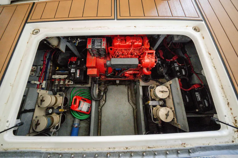 Slide: The Image of Engine compartment of 1998 Sea Ray 400 Sedan Bridge with visible components and wiring. - 41