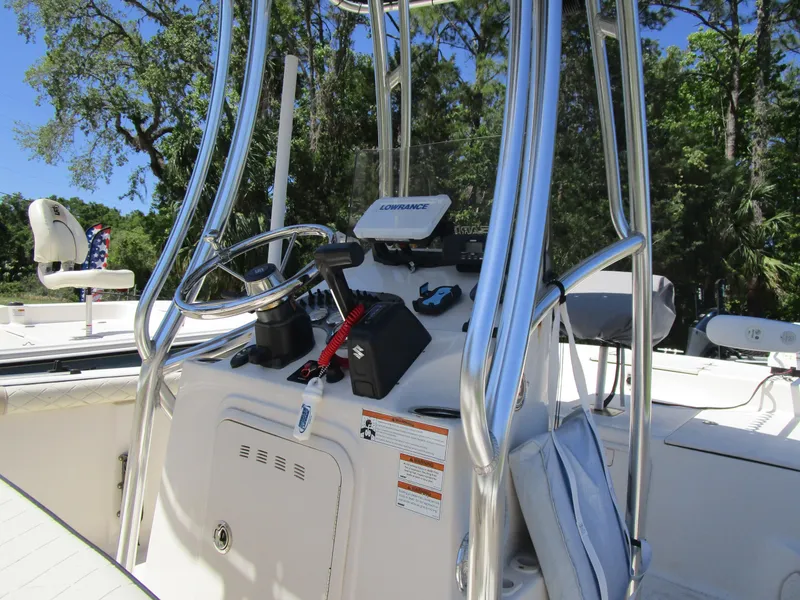 Slide: The Image of 2020 Carolina Skiff 19 LS boat console with steering wheel and navigation equipment. - 13