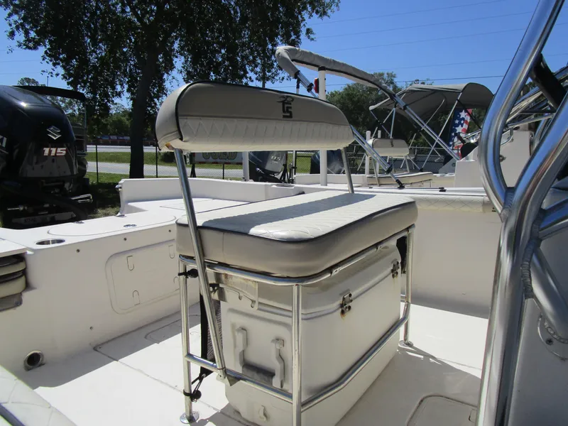 Slide: The Image of 2020 Carolina Skiff 19 LS boat interior with cushioned seating and storage. - 14