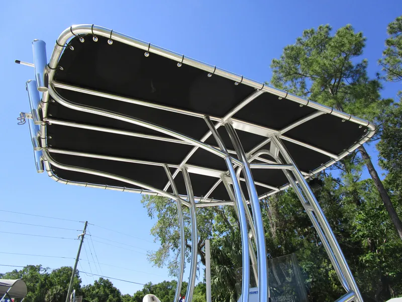 Slide: The Image of 2020 Carolina Skiff 19 LS boat T-top against clear blue sky. - 6