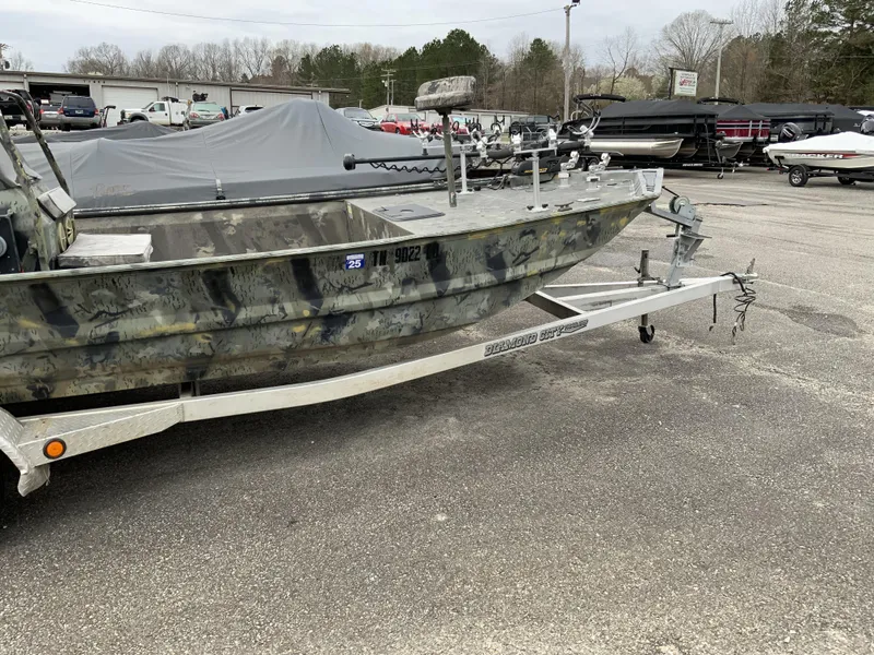 Slide: The Image of 2006 War Eagle 2072CC boat on trailer in outdoor lot. - 3