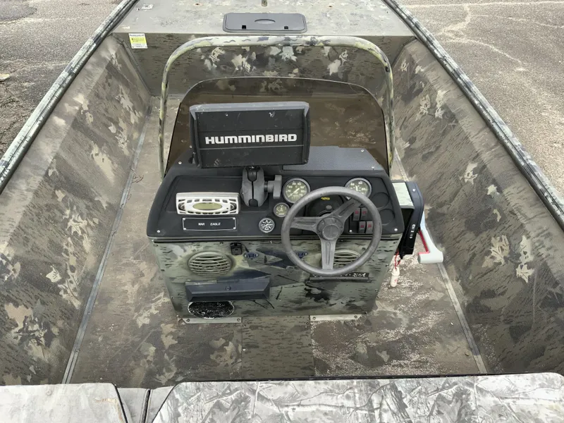 Slide: The Image of 2006 War Eagle 2072CC boat console with Humminbird electronics and camouflage design. - 7