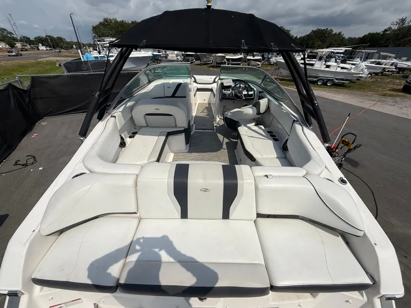 Slide: The Image of 2017 Regal 22 FasDeck boat with spacious seating and sleek design. - 14