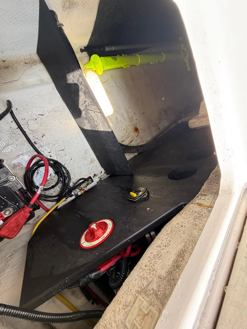 Slide: The Image of 2017 Regal 22 FasDeck interior compartment with wiring and storage space. - 16