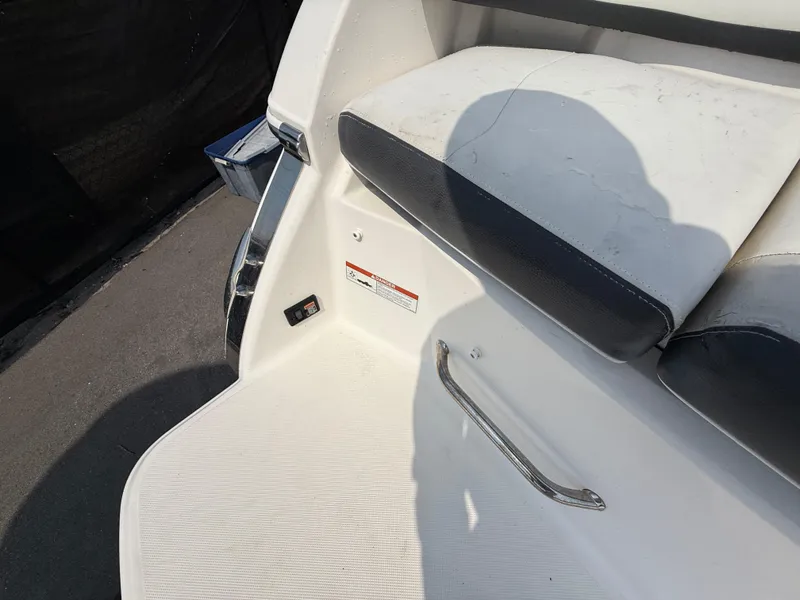 Slide: The Image of 2017 Regal 22 FasDeck boat interior with seating and handle. - 17