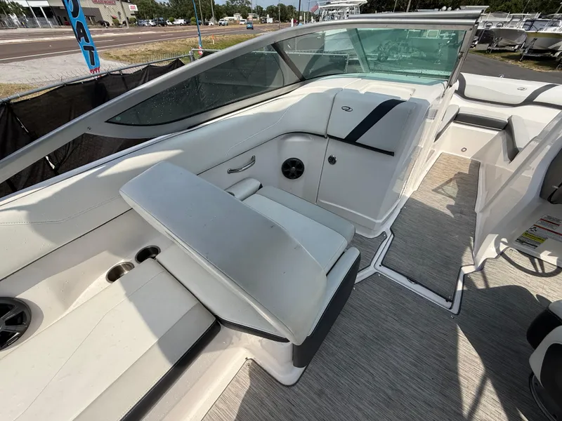 Slide: The Image of 2017 Regal 22 FasDeck boat interior with white seating and modern design. - 24