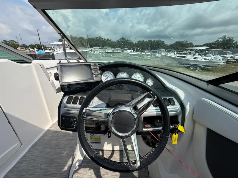 Slide: The Image of Steering wheel and dashboard of 2017 Regal 22 FasDeck boat. - 28
