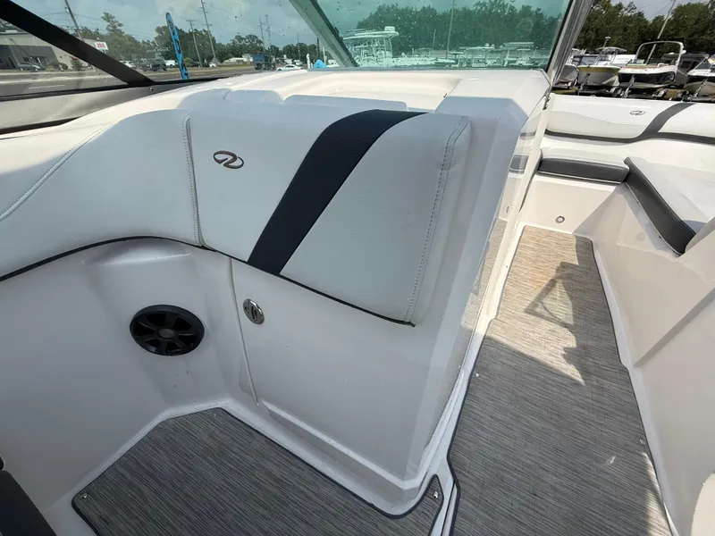 Slide: The Image of 2017 Regal 22 FasDeck boat interior with cushioned seating and speaker. - 36