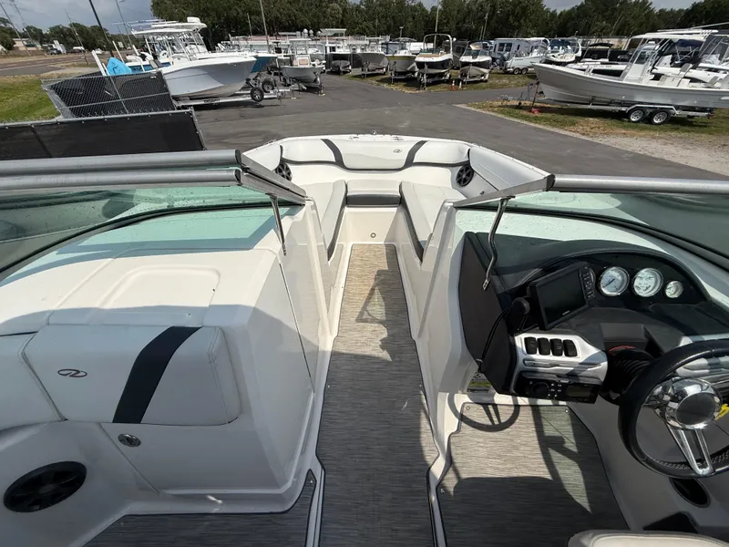 Slide: The Image of 2017 Regal 22 FasDeck boat interior with steering wheel and seating area. - 38