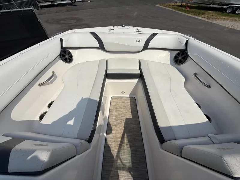 Slide: The Image of 2017 Regal 22 FasDeck boat interior with white seating and speakers. - 42