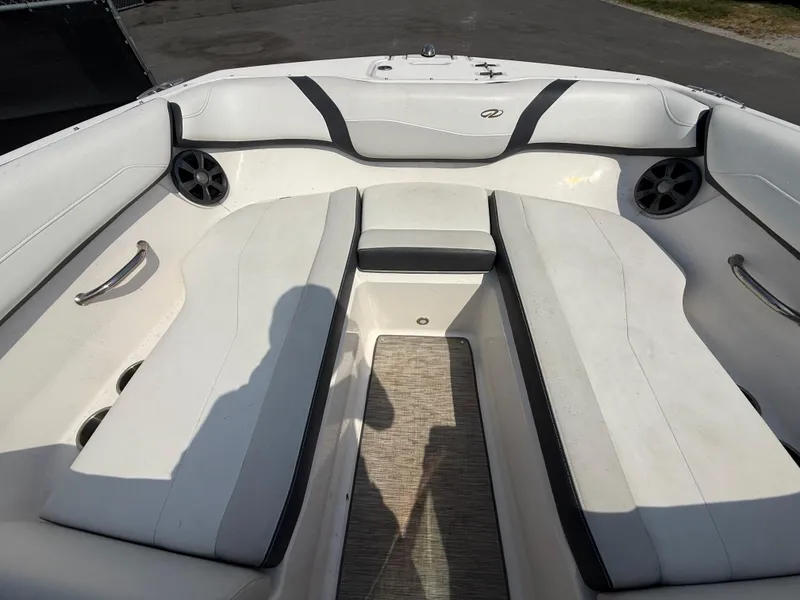 Slide: The Image of 2017 Regal 22 FasDeck boat interior with white seating and speakers. - 43