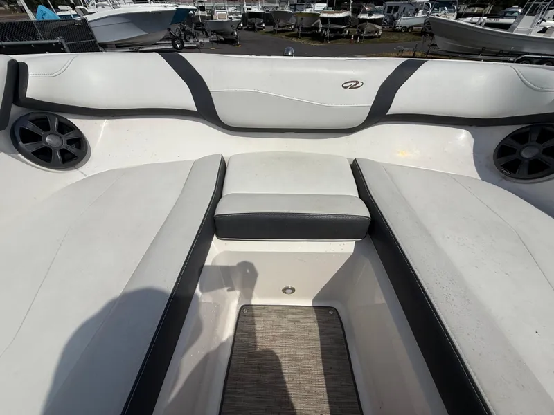 Slide: The Image of 2017 Regal 22 FasDeck boat interior with cushioned seating and speaker system. - 48
