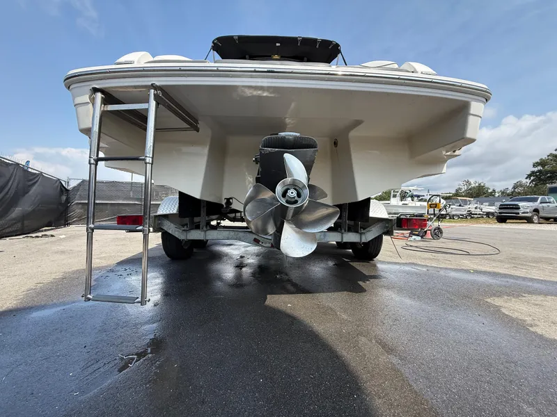 Slide: The Image of 2017 Regal 22 FasDeck boat rear view with propeller and ladder. - 6