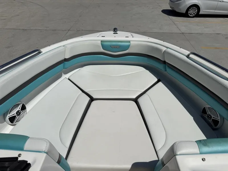 Slide: The Image of 2016 Chaparral VRX 203 boat interior with white and teal seating. - 12