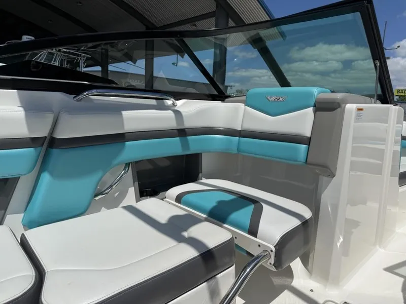 Slide: The Image of 2016 Chaparral VRX 203 boat interior with turquoise and white seating. - 13