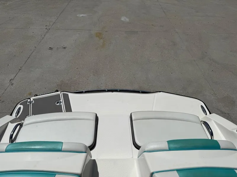 Slide: The Image of 2016 Chaparral VRX 203 boat interior with white and teal seating. - 7