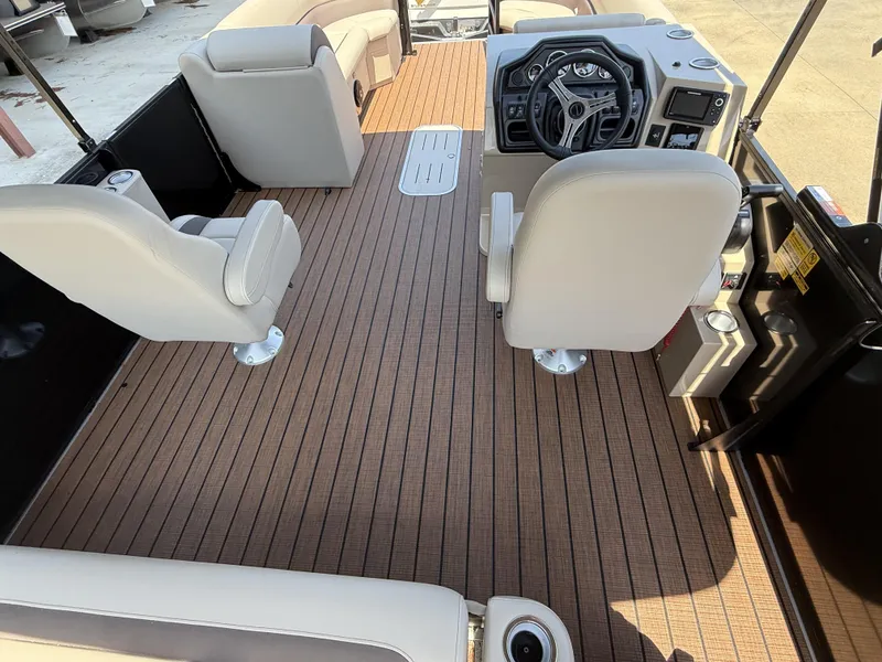 Slide: The Image of 2025 Bentley Pontoons Legacy 243 Swingback interior with modern helm and seating. - 5