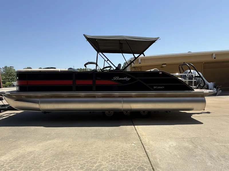 Slide: The Image of 2025 Bentley Pontoons Legacy 243 Swingback 3/4 Tube, black and red, parked outdoors. - 9