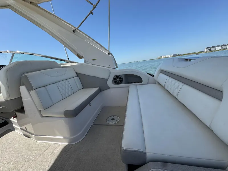 Slide: The Image of 2020 Regal 28 Express boat interior with comfortable seating and ocean view. - 21