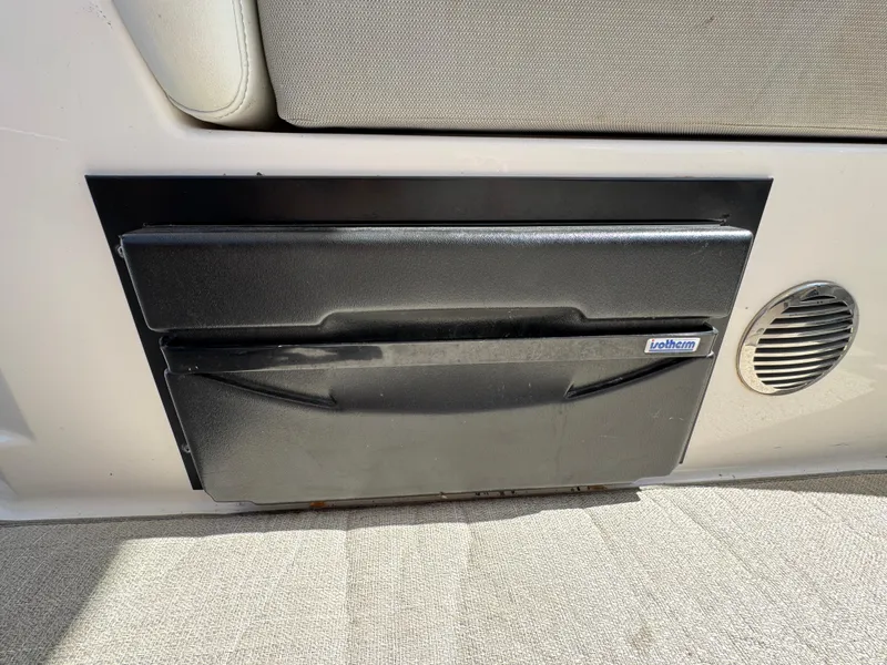 Slide: The Image of 2020 Regal 28 Express interior storage compartment with speaker detail. - 27