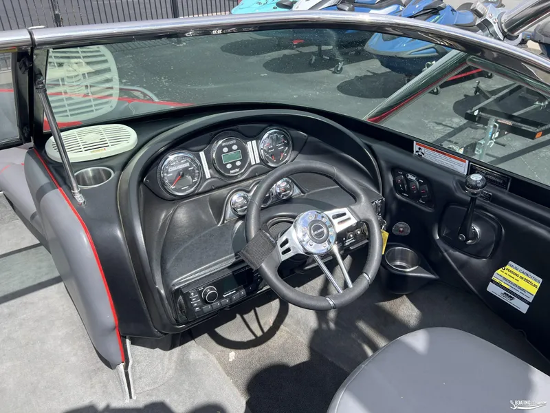 Slide: The Image of 2008 Calabria PRO V boat dashboard with steering wheel and control panel. - 11