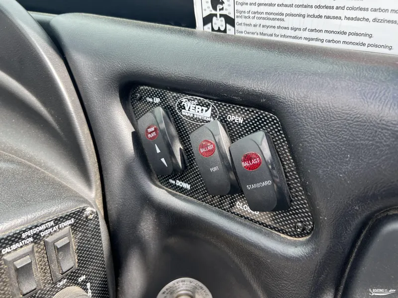 Slide: The Image of Control panel of a 2008 Calabria PRO V boat with ballast and trim plate switches. - 13