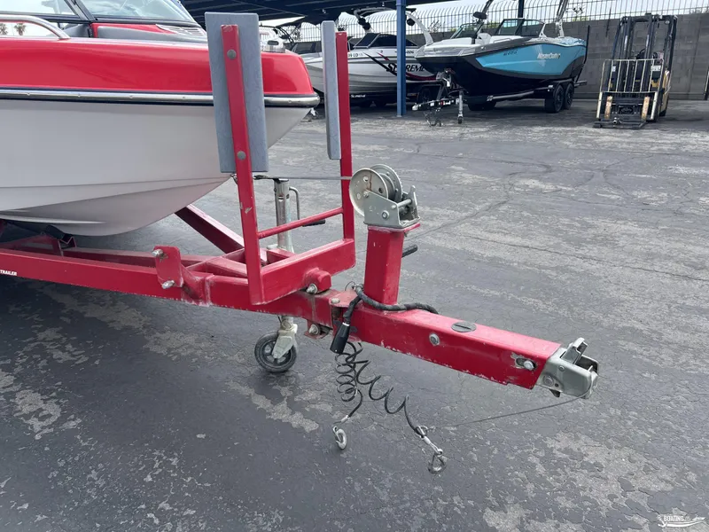 Slide: The Image of Red boat trailer hitch for 2008 Calabria PRO V, parked on asphalt. - 14