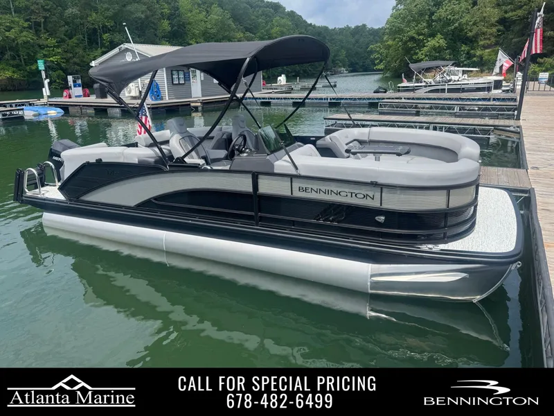 Slide: The Image of 2025 Bennington 22MFB pontoon boat docked at a marina, available at Atlanta Marine. - 1