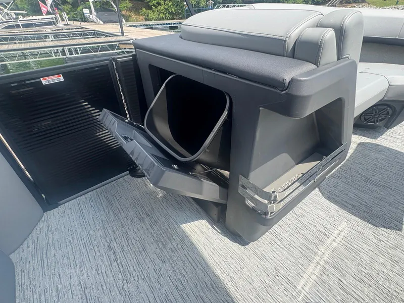 Slide: The Image of 2025 Bennington 22MFB boat with open storage compartment on deck. - 27