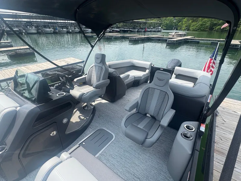 Slide: The Image of 2025 Bennington 22MFB pontoon boat interior with plush seating and modern helm. - 32