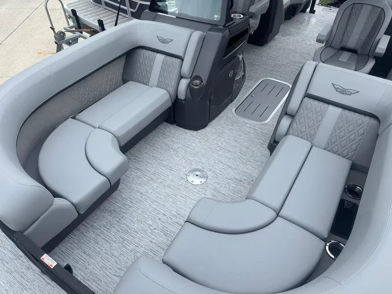 Slide: The Image of 2025 Bennington 22MFB boat interior with luxurious gray seating and modern design. - 4