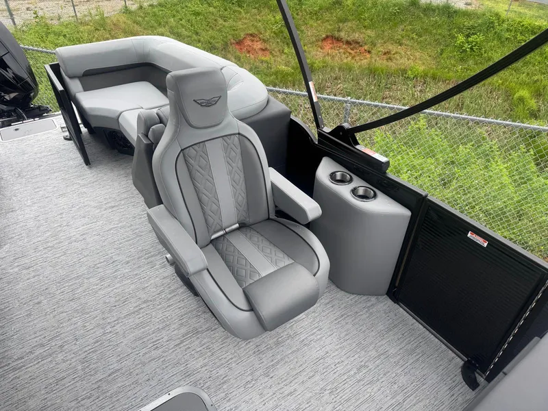 Slide: The Image of 2025 Bennington 22MFB boat interior with gray seating and cup holders. - 6