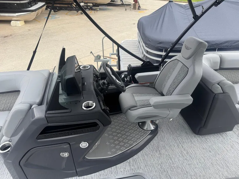 Slide: The Image of 2025 Bennington 22MFB boat interior with modern helm and luxurious seating. - 7