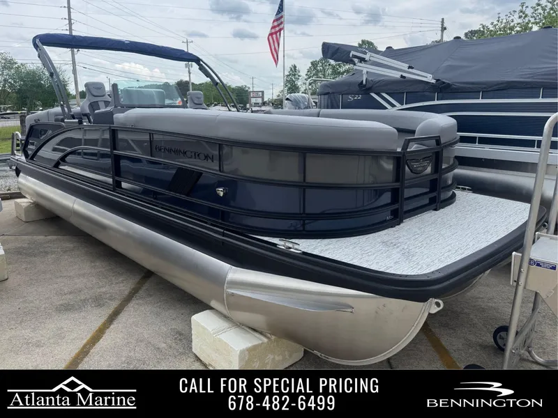 Slide: The Image of 2025 Bennington 24MFB pontoon boat displayed at Atlanta Marine dealership. - 1