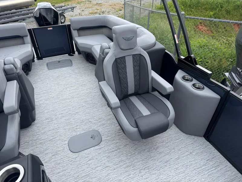 Slide: The Image of 2025 Bennington 24MFB boat interior with luxurious gray seating and modern design. - 10
