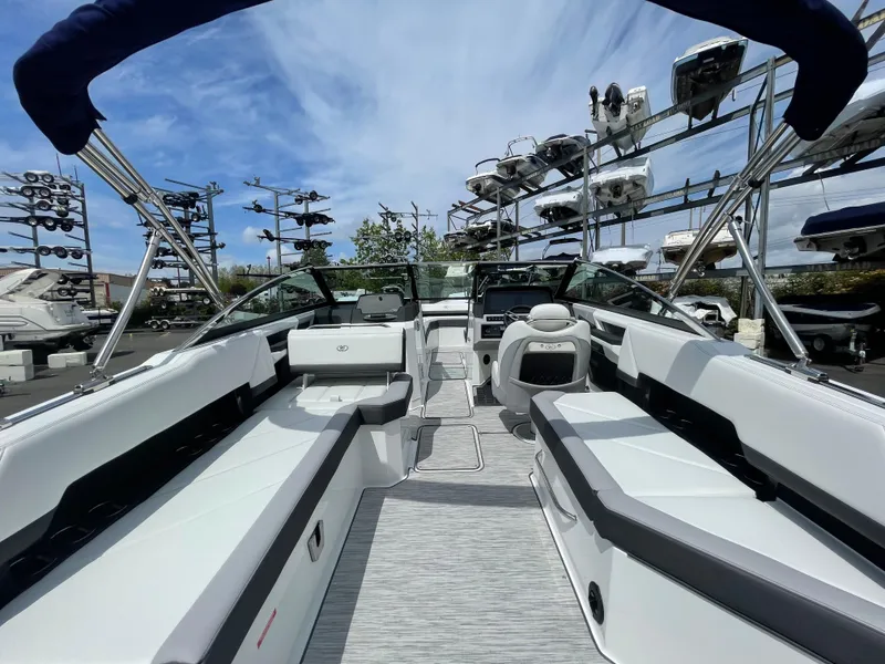 Slide: The Image of 2022 Cobalt R8 boat interior with sleek seating and modern design, displayed outdoors. - 12