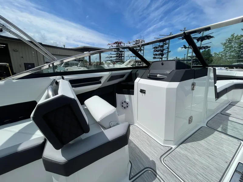 Slide: The Image of 2022 Cobalt R8 boat interior with sleek seating and modern dashboard design. - 7
