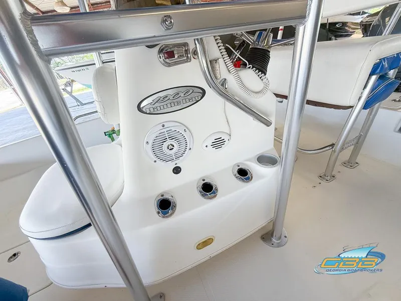 Slide: The Image of 2004 NauticStar 1900 Nautic Bay boat console with controls and seating. - 28