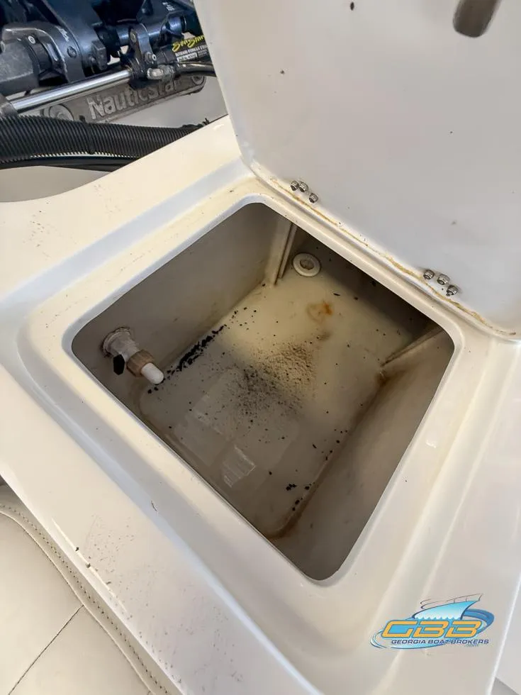 Slide: The Image of Open storage compartment on 2004 NauticStar 1900 Nautic Bay boat, showing interior details. - 31